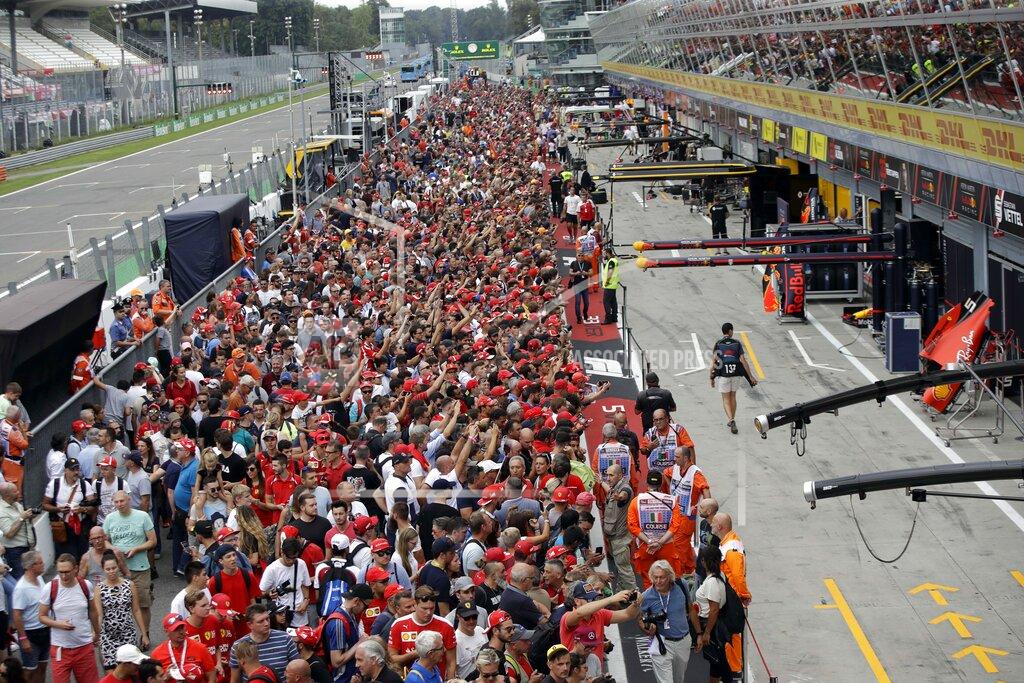 Luca Bruno Formula One supporters gather in the pit lanes at the Monza racetrack, in Monza, Italy , Thursday, Sept.5, 2019. The Formula one race will be held on Sunday. (AP Photo/Luca Bruno)