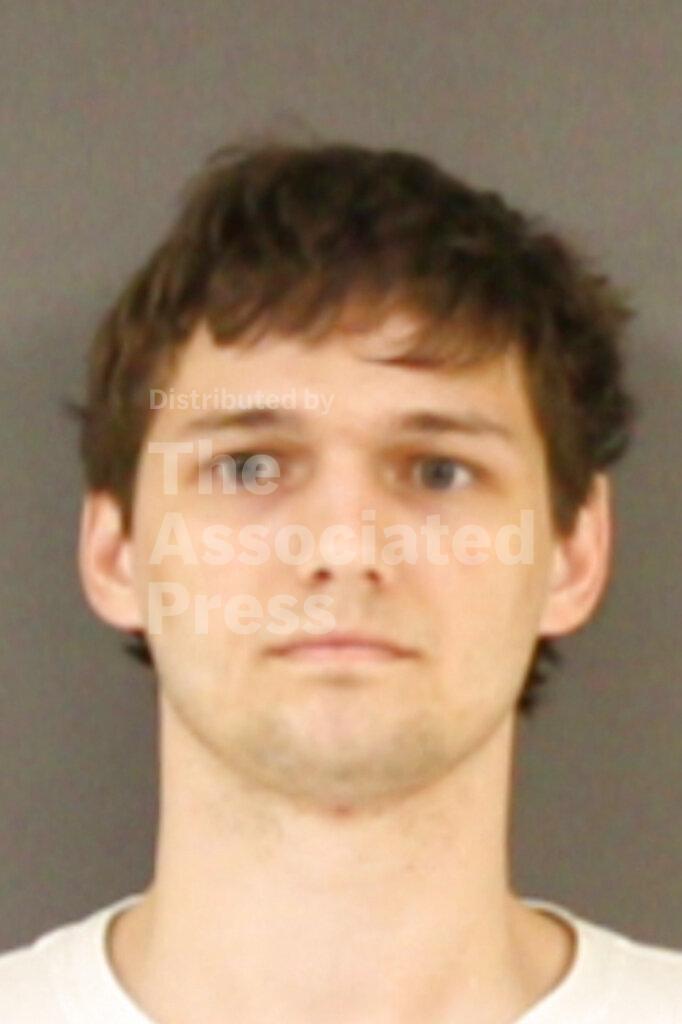 This Wednesday, Feb. 5, 2020, Hinds County Detention Center booking photograph shows former Mississippi Department of Human Services employee Latimer Smith, in Raymond, Miss. Smith and five other people were indicted and arrested for allegedly embezzling millions in federal money meant for the poor through an investigation by the Mississippi State Auditor's office. (Hinds County Detention Center via AP)
