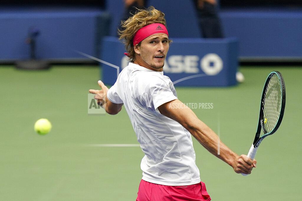 Seth Wenig Alexander Zverev, of Germany, returns a shot to Dominic Thiem, of Austria, during the men's singles final of the US Open tennis championships, Sunday, Sept. 13, 2020, in New York. (AP Photo/Seth Wenig)