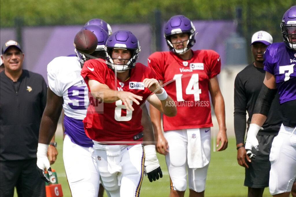 Jim Mone Minnesota Vikings quarterback Kirk Cousins (8) throws during the NFL football team's training camp, Friday, Aug. 6, 2021, in Eagan, Minn. Quarterback Nate Stanley (14) looks on. (AP Photo/Jim Mone)
