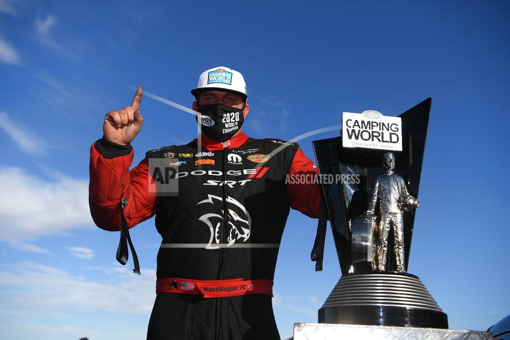 Jerry Foss In this photo provided by the NHRA, Funny Car's Matt Hagan scored his third world title at Dodge NHRA Finals presented by Pennzoil and went on to win the event over teammate Ron Capps thanks to his 3.914-second pass at 326.40 mph, Sunday, Nov. 1, 2020, in Las Vegas. (Jerry Foss/NHRA via AP)