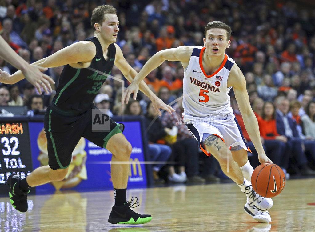 Zack Wajsgras Virginia's guard Kyle Guy (5) drives past Marshall's Jon Elmore (33) during the second half of an NCAA college basketball game on Monday, Dec. 31, 2018, in Charlottesville, Va. Virginia beat Marshall 100-64. (AP Photo/Zack Wajsgras)