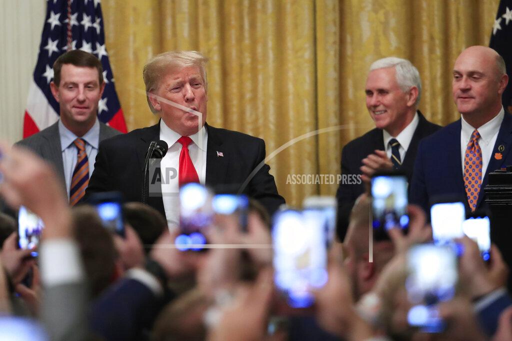 Manuel Balce Ceneta President Donald Trump joined by, from left, Clemson head coach Dabo Swinney, Vice President Mike Pence, and Clemson President James Clements, welcomes the 2018 college football playoff National Champion Clemson Tigers to the White House in Washington, Monday, Jan. 14, 2019. (AP Photo/Manuel Balce Ceneta)