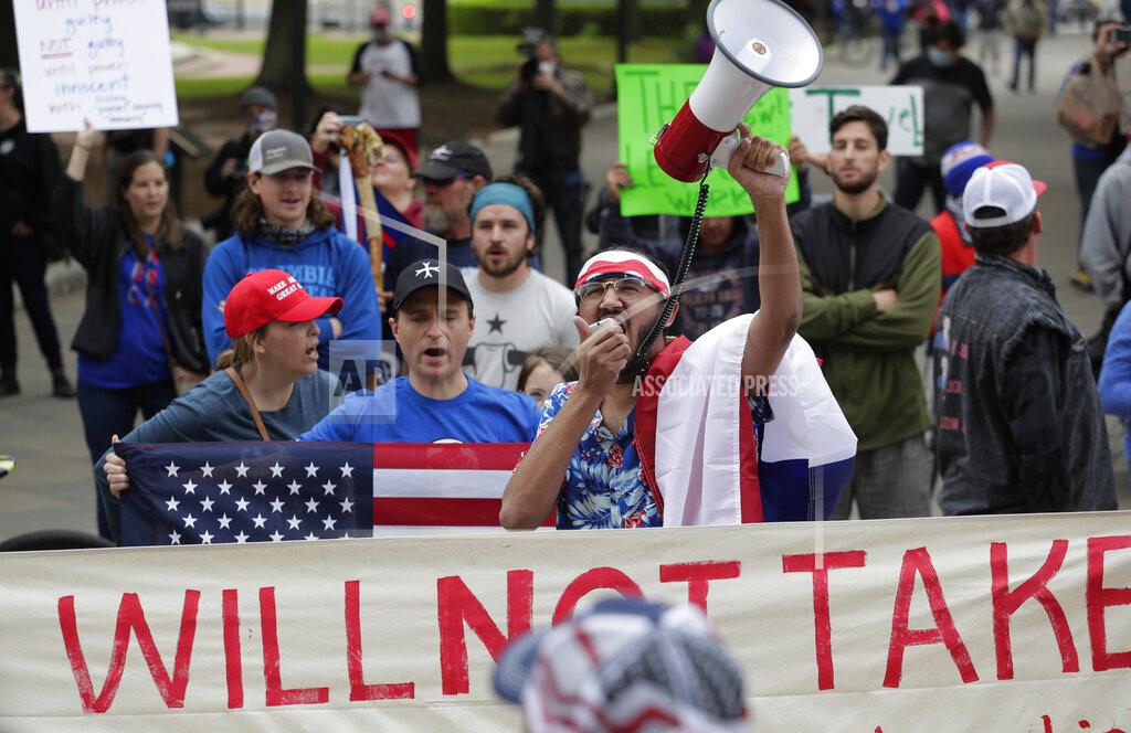 Eric Gay Protesters rally at the Texas State Capitol to speak out against Texas' handling of the COVID-19 outbreak, in Austin, Texas, Saturday, April 18, 2020. Austin and many other Texas cities remain under stay-at-home orders due to the COVID-19 outbreak except for essential personal. (AP Photo/Eric Gay)