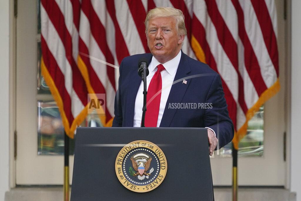 FILE - In this Tuesday, May 26, 2020 file photo, President Donald Trump answers questions from reporters during an event on protecting seniors with diabetes in the Rose Garden White House in Washington. On Tuesday, Twitter took the unprecedented step of adding fact-check alerts to two of Trump’s tweets about voting by mail. The next day the president threatened social media companies with new regulation or even shuttering. (AP Photo/Evan Vucci, File)
