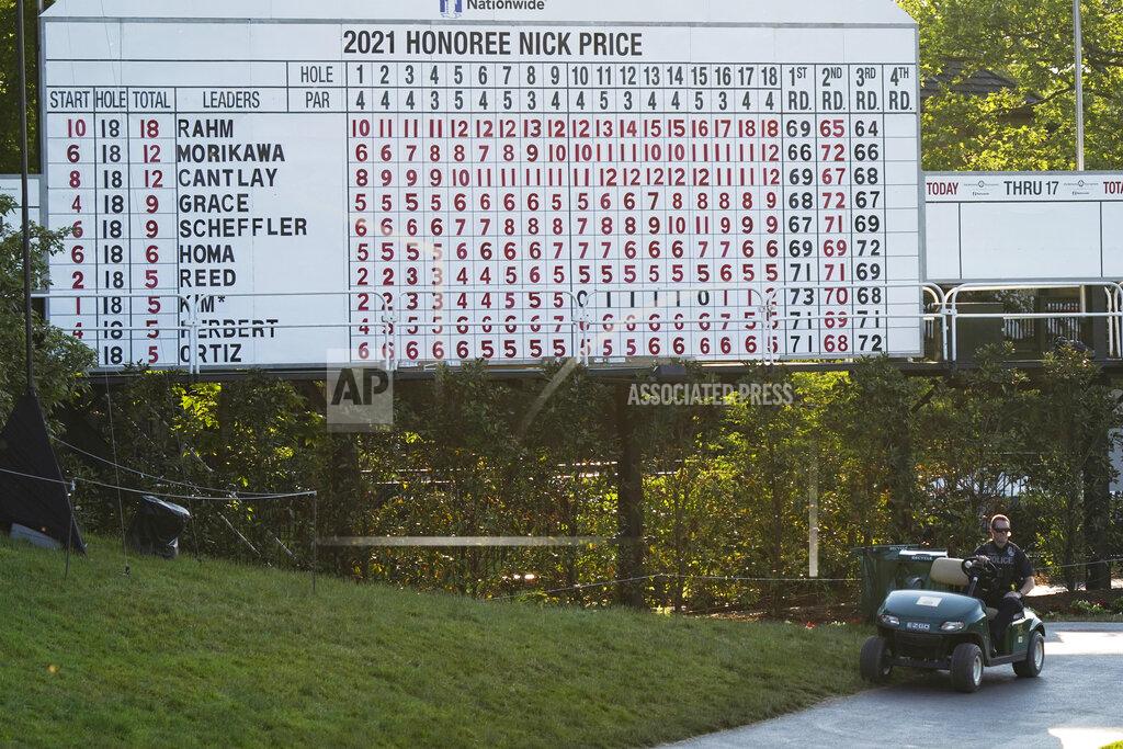 Darron Cummings A police officer sits on a cart under the scoreboard following the third round of the Memorial golf tournament Saturday, June 5, 2021, in Dublin, Ohio. Jon Rahm was notified he tested positive for the coronavirus, knocking him out of the tournament after finishing his round. (AP Photo/Darron Cummings)