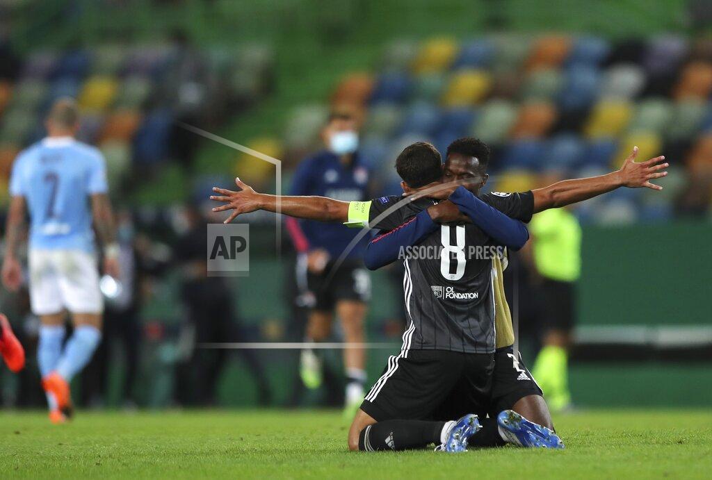 Miguel A. Lopes Lyon's Houssem Aouar reacts at the end of the Champions League quarterfinal soccer match between Lyon and Manchester City at the Jose Alvalade stadium in Lisbon, Portugal, Saturday, Aug. 15, 2020. Lyon won the match 3-1. (Miguel A. Lopes/Pool via AP)