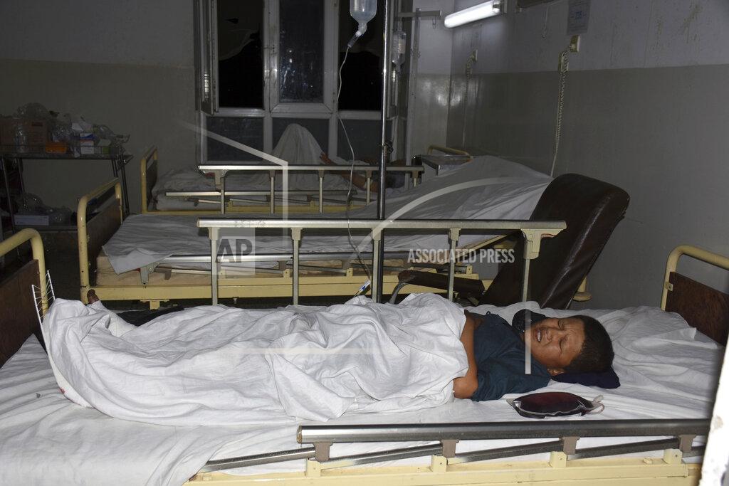 Masih Paeiz A wounded boy receives treatment in a hospital, after a bombing in Mazar-e-Sharif, northern Afghanistan, Wednesday, May 25, 2022. A series of explosions shook Afghanistan on Wednesday, the Taliban said, including a blast inside a mosque in the capital of Kabul that killed at least five worshippers and three bombings of minivans in the country's north that killed nine passengers. (AP Photo/Masih Paeiz)