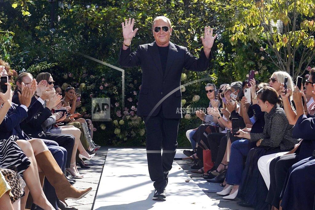 Richard Drew Michael Kors acknowledges audience applause after his Spring/Summer 2022 collection was modeled during Fashion Week in New York, Friday, Sept. 10, 2021. (AP Photo/Richard Drew)