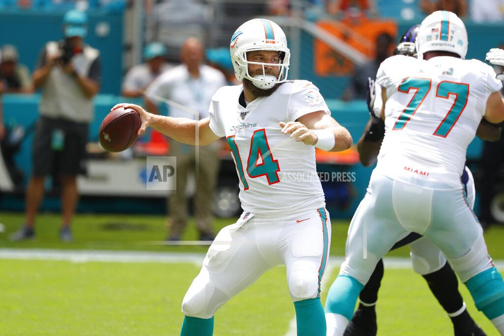 Wilfredo Lee Miami Dolphins quarterback Ryan Fitzpatrick (14) looks to pass, during the first half at an NFL football game against the Baltimore Ravens, Sunday, Sept. 8, 2019, in Miami Gardens, Fla. (AP Photo/Wilfredo Lee)