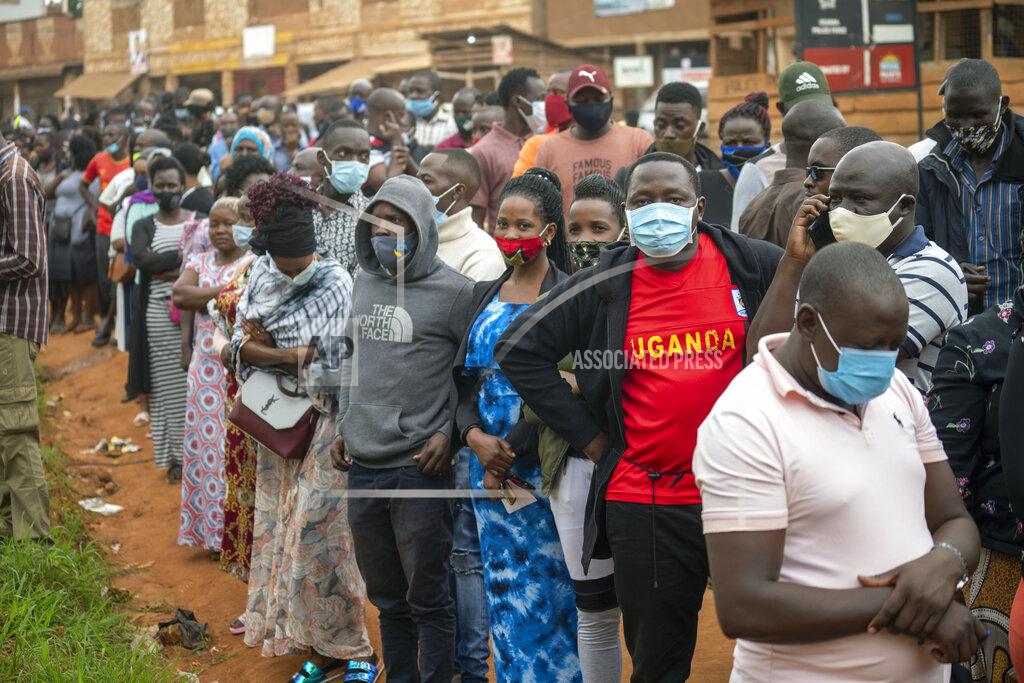 Jerome Delay Ugandans wait to vote in Kampala, Uganda, Thursday, Jan. 14, 2021.Ugandans are voting in a presidential election tainted by widespread violence that some fear could escalate as security forces try to stop supporters of leading opposition challenger BobiWine from monitoring polling stations.(AP Photo/Jerome Delay)