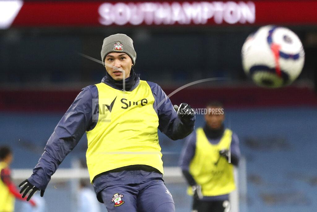 Martin Rickett Southampton's Takumi Minamino during the warm up before the English Premier League soccer match between Manchester City and Southampton at the Etihad Stadium in Manchester, England, Wednesday, March 10, 2021. (Martin Rickett/Pool via AP)