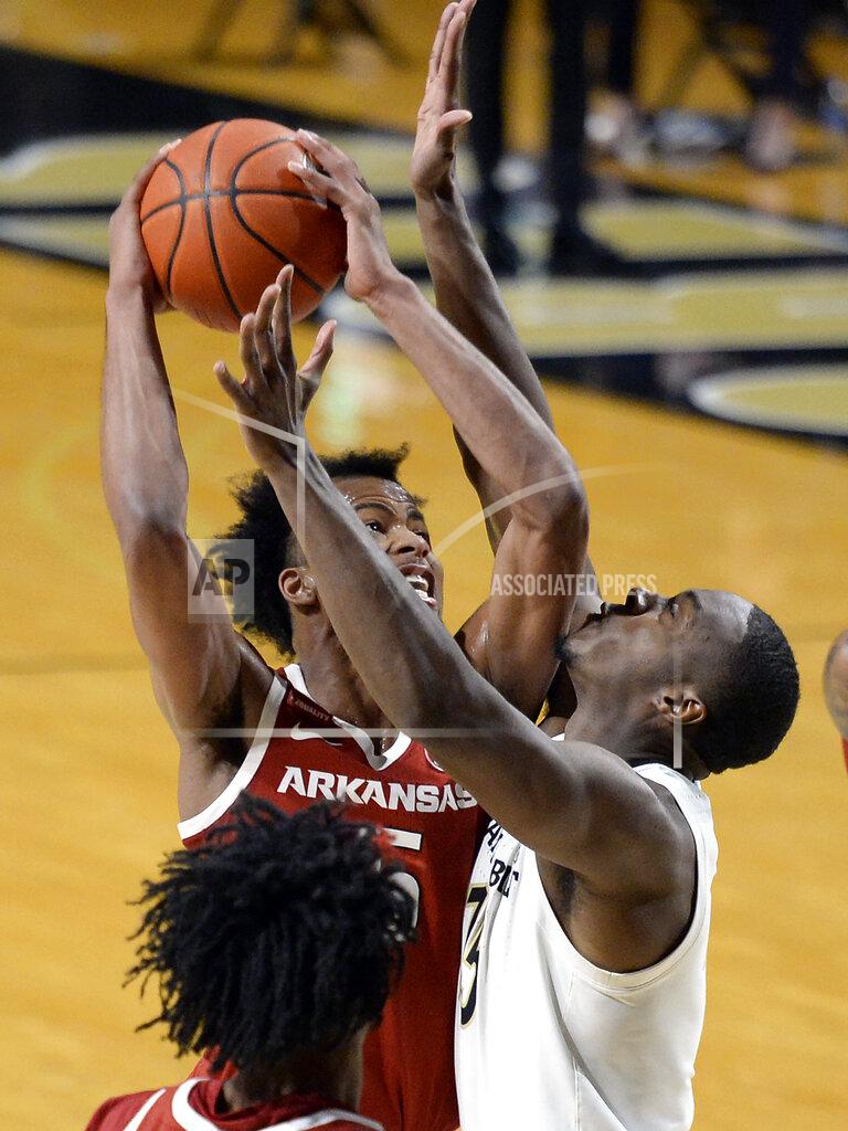 Mark Zaleski Arkansas guard Moses Moody, left, goes to the basket as Vanderbilt forward Clevon Brown (15) defends during the second half of an NCAA college basketball game, Saturday, Jan. 23, 2021, in Nashville, Tenn. Arkansas won 92-71. (AP Photo/Mark Zaleski)