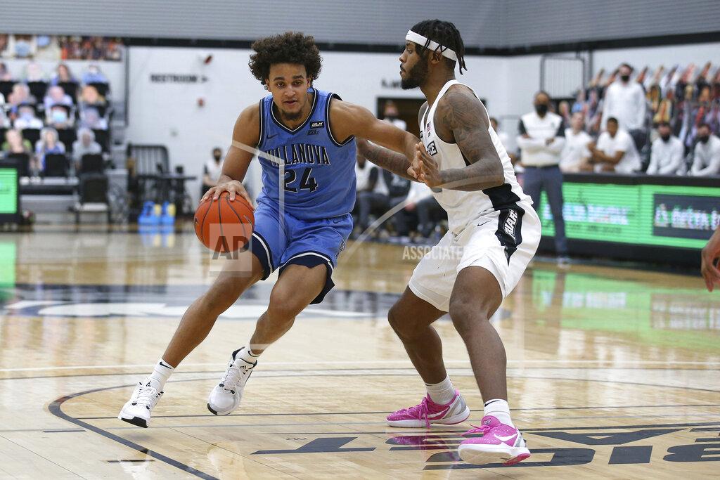Stew Milne Providence's Nate Watson (0) defends Villanova's Jeremiah Robinson-Earl (24) during an NCAA college basketball game in Providence, R.I., Saturday, March 6, 2021. Providence won, 54-52. (AP Photo/Stew Milne)