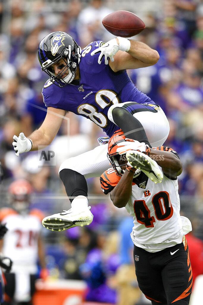 Nick Wass Baltimore Ravens tight end Mark Andrews, top, fumbles the ball while trying to leap over Cincinnati Bengals defensive back Brandon Wilson (40) during the first half of a NFL football game Sunday, Oct. 13, 2019, in Baltimore. The Bengals recovered the fumble. (AP Photo/Nick Wass)