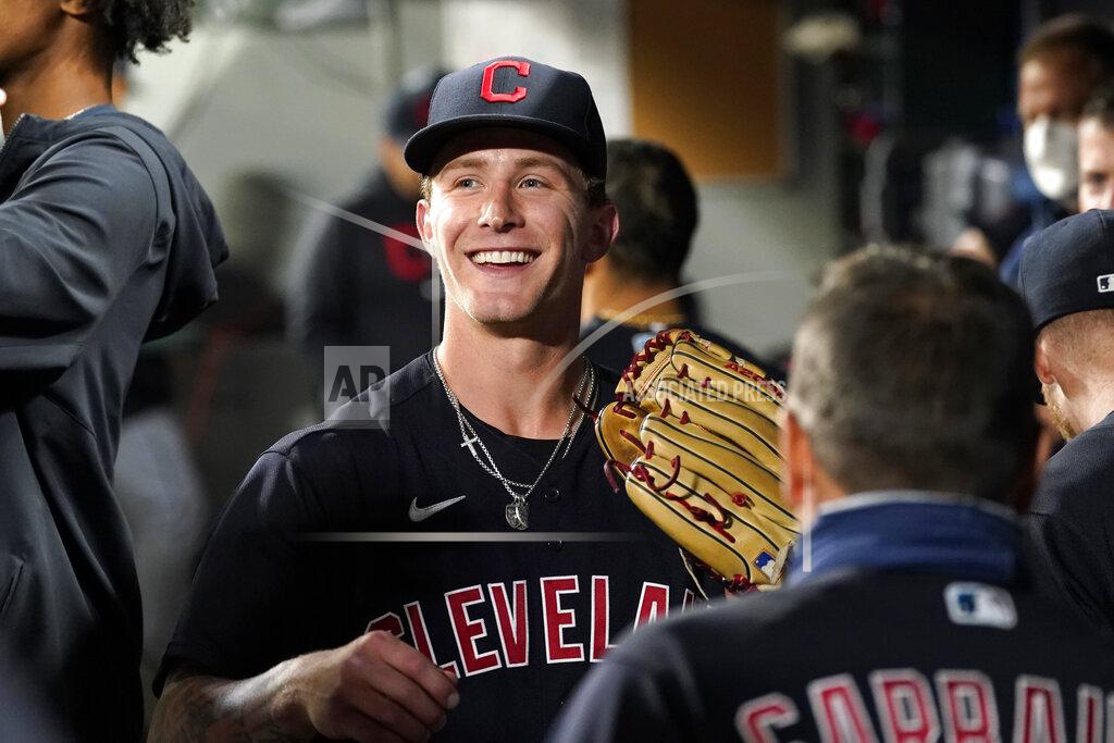 Elaine Thompson Cleveland Indians starting pitcher Zach Plesac smiles as he greets teammates in the dugout after the seventh inning of the team's baseball game against the Seattle Mariners on Thursday, May 13, 2021, in Seattle. (AP Photo/Elaine Thompson)