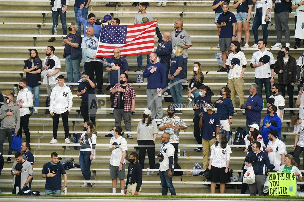 Frank Franklin Ii Fans stand during the playing of the national anthem before a baseball game between the New York Yankees and the Houston Astros Tuesday, May 4, 2021, in New York. (AP Photo/Frank Franklin II)