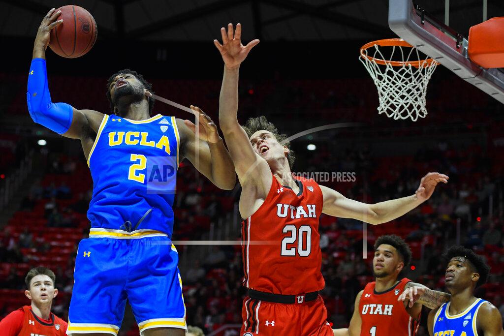 Alex Goodlett UCLA forward Cody Riley (2) grabs a rebound over Utah forward Mikael Jantunen (20) during the first half of an NCAA college basketball game Thursday, Feb. 20, 2020, in Salt Lake City. (AP Photo/Alex Goodlett)