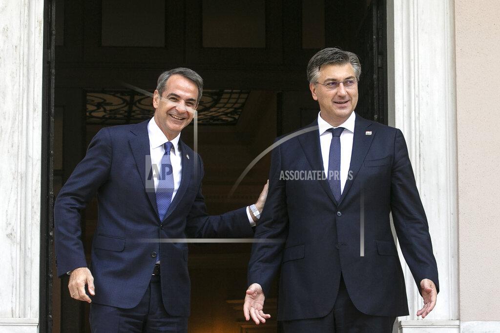 Yorgos Karahalis Greece's Prime Minister Kyriakos Mitsotakis, left, welcomes his Croatian counterpart Andrej Plenkovic in Athens, on Friday, Sept. 17, 2021. Plenkovic is in Athens to attend a Mediterranean summit. (AP Photo/Yorgos Karahalis)