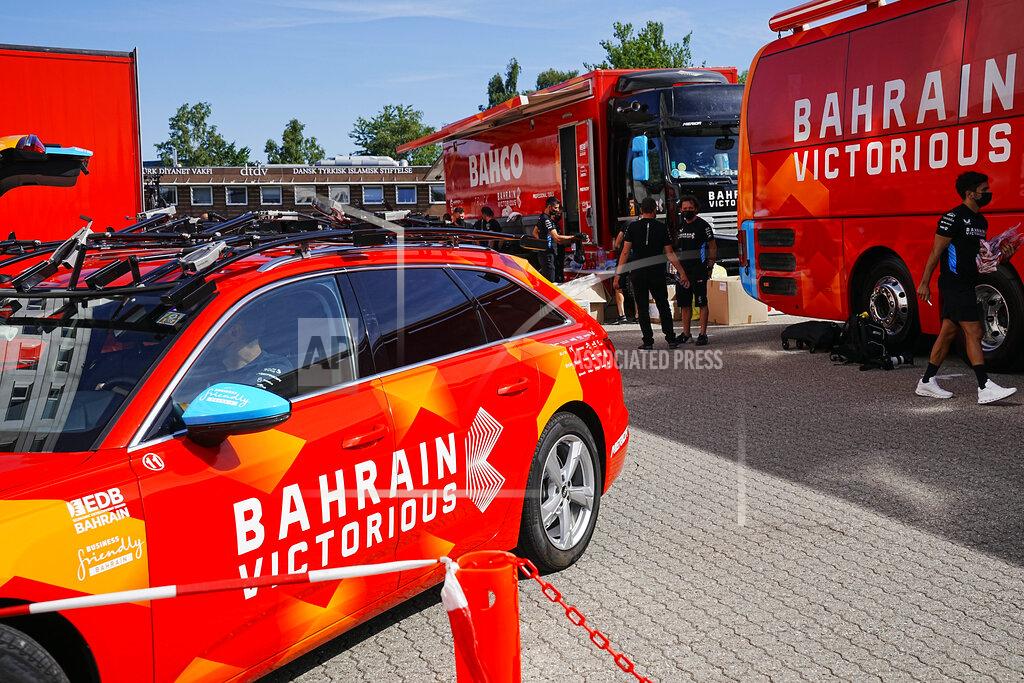 Bo Amstrup Bahrain Victorious staff outside their hotel in Glostrup, Denmark, Thursday, June 30, 2022. The Bahrain Victorious team at the Tour de France has been raided by police for the second time this week. Danish police searched the riders' hotel rooms in suburban Copenhagen on Thursday. (Bo Amstrup/Ritzau Scanpix via AP)
