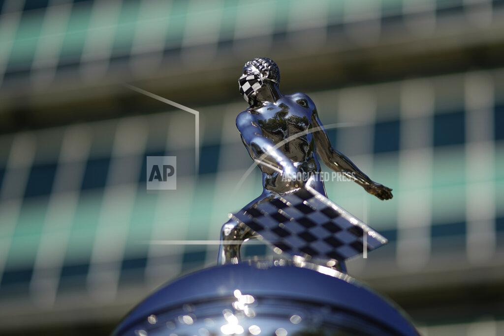 Darron Cummings The top Borg-Warner Trophy complete with a checkered flag mask, is displayed outside of the Pagoda before the Indianapolis 500 auto race at Indianapolis Motor Speedway, Sunday, Aug. 23, 2020, in Indianapolis.(AP Photo/Darron Cummings)