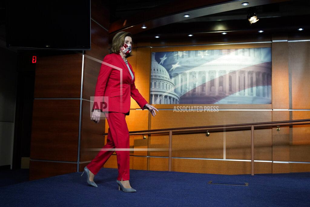 Jacquelyn Martin House Speaker Nancy Pelosi of Calif., arrives to speak to the media, Wednesday Dec. 30, 2020, on Capitol Hill in Washington. (AP Photo/Jacquelyn Martin)