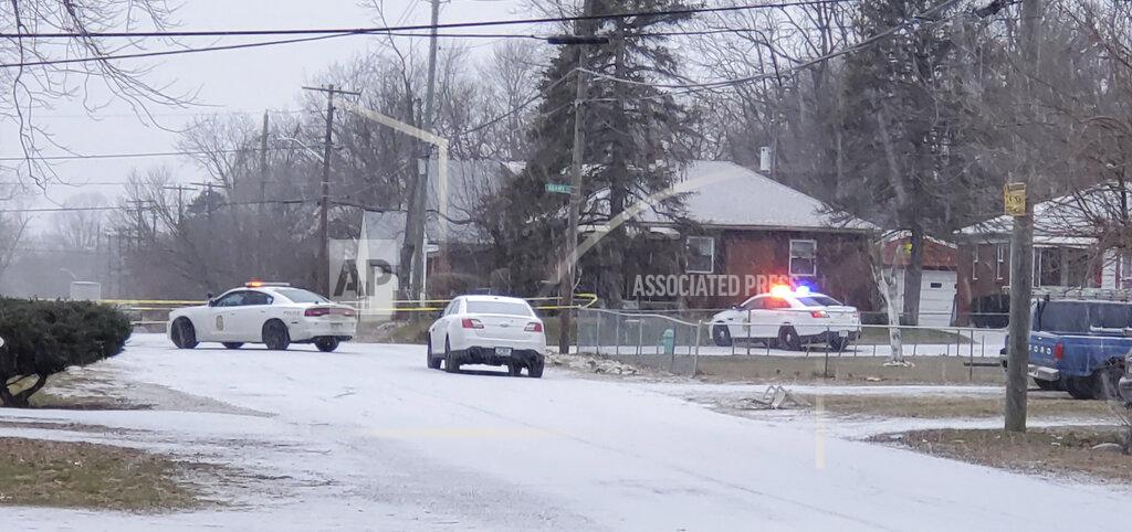 Justin L. Mack Indianapolis Metropolitan Police Department work the scene Sunday, Jan. 24, 2021 in Indianapolis where five people, including a pregnant woman, were shot to death early Sunday inside an Indianapolis home. Th pregnant woman who was taken to an area hospital, both she and the unborn child died despite life-saving efforts. (Justin L. Mack/The Indianapolis Star via AP)