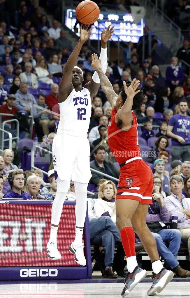 Tony Gutierrez TCU forward Kouat Noi (12) shoots a 3-point basket over Texas Tech forward Deshawn Corprew (3) in the second half of an NCAA college basketball game in Fort Worth, Texas, Saturday, March 2, 2019. (AP Photo/Tony Gutierrez)