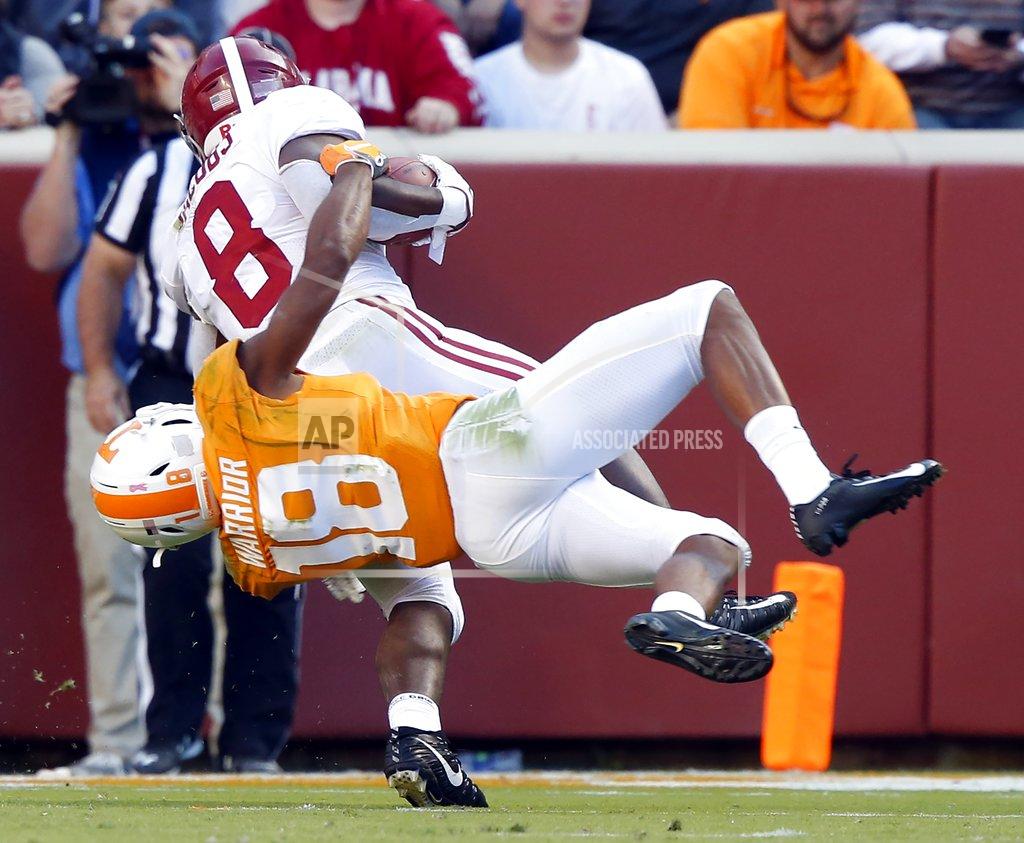 Wade Payne Alabama running back Josh Jacobs (8) is tackled from behind by Tennessee defensive back Nigel Warrior (18) in the first half of an NCAA college football game Saturday, Oct. 20, 2018, in Knoxville, Tenn. (AP Photo/Wade Payne)