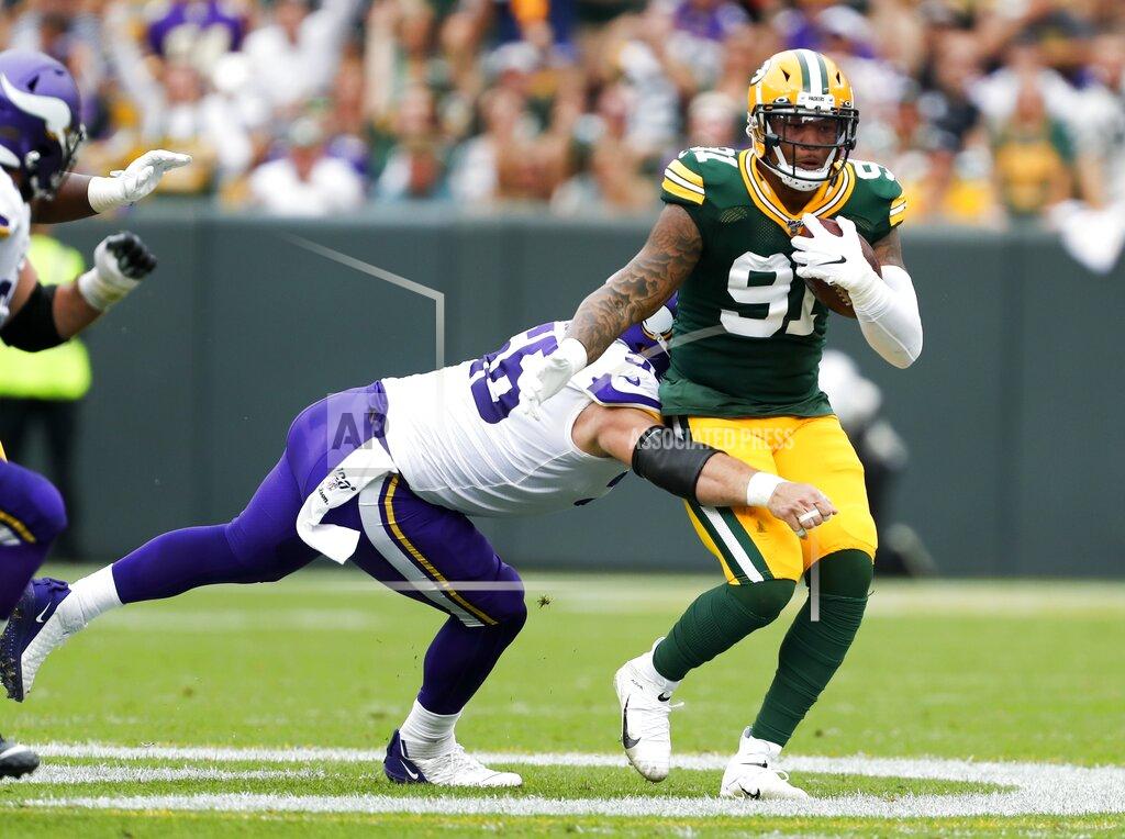 Matt Ludtke Green Bay Packers' Preston Smith intercepts a pass during the first half of an NFL football game against the Minnesota Vikings Sunday, Sept. 15, 2019, in Green Bay, Wis. (AP Photo/Matt Ludtke)