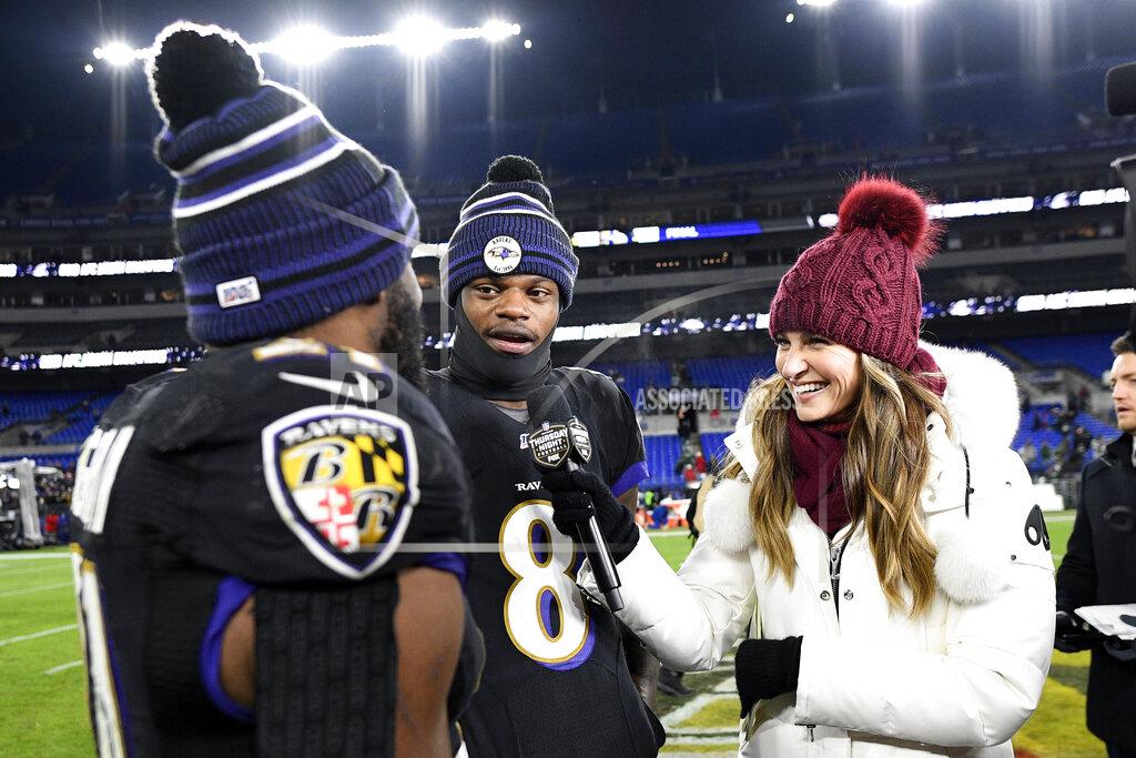 Nick Wass Baltimore Ravens running back Mark Ingram, left, pretends to interview quarterback Lamar Jackson (8) while standing with Fox sideline reporter Erin Andrews after an NFL football game against the New York Jets, Thursday, Dec. 12, 2019, in Baltimore. The Ravens won 42-21. (AP Photo/Nick Wass)