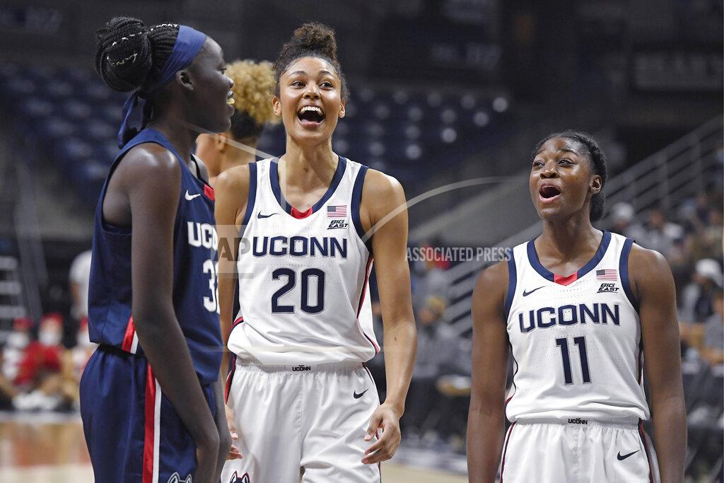 Jessica Hill Connecticut's Piath Gabriel, left, Olivia Nelson-Ododa and Mir McLean, right, laugh during First Night events for the UConn men's and women's NCAA college basketball teams Friday, Oct. 15, 2021, in Storrs, Conn. (AP Photo/Jessica Hill)