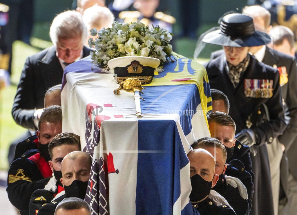 Danny Lawson Pall Bearers carrying the coffin of the Duke of Edinburgh, followed by the Prince of Wales, left and Princess Anne, right, into St George's Chapel for his funeral, at Windsor Castle, in Windsor, England, Saturday April 17, 2021. Prince Philip died April 9 at the age of 99 after 73 years of marriage to Britain's Queen Elizabeth II. (Danny Lawson/Pool via AP)