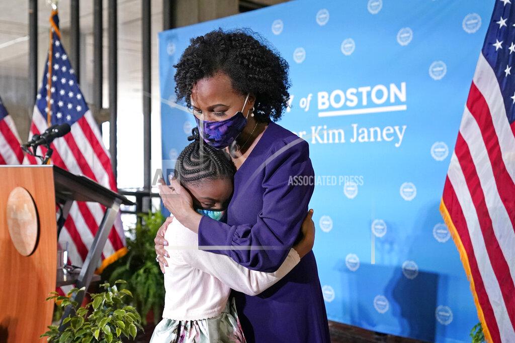 Elise Amendola Former Boston City Council President Kim Janey, 55, hugs her granddaughter, Rosie, after she was sworn in as Boston's new mayor at City Hall, Wednesday, March 24, 2021, in Boston. Janey, who is the city's first female and first person of color to take the office, replaces Marty Walsh who resigned Monday evening to become President Joe Biden's labor secretary. (AP Photo/Elise Amendola)