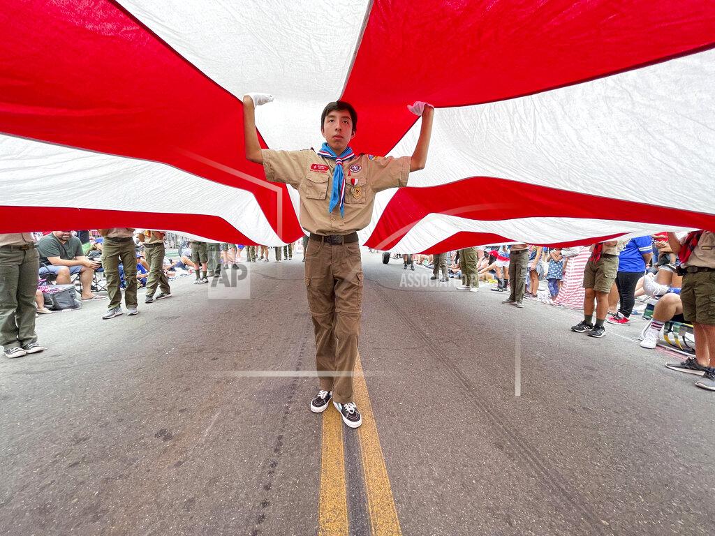 Jeff Gritchen Boy Scouts carry Huntington Beach's Historic Freedom Flag up Main Street during The 118th Huntington Beach 4th of July Parade in Huntington Beach, Calif., on Monday, July 4, 2022. (Jeff Gritchen/The Orange County Register via AP)