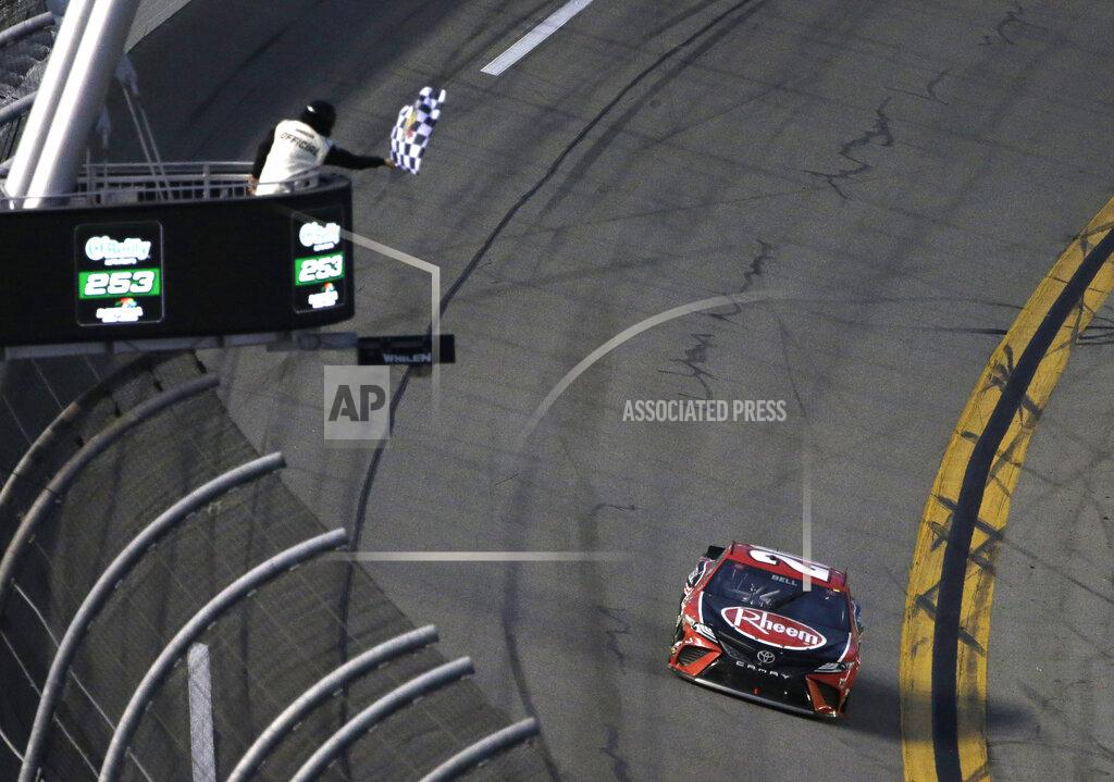 Terry Renna Christopher Bell gets the checkered flag as he drives to the finish line during the NASCAR Cup Series road-course auto race at Daytona International Speedway, Sunday, Feb. 21, 2021, in Daytona Beach, Fla. (AP Photo/Terry Renna)