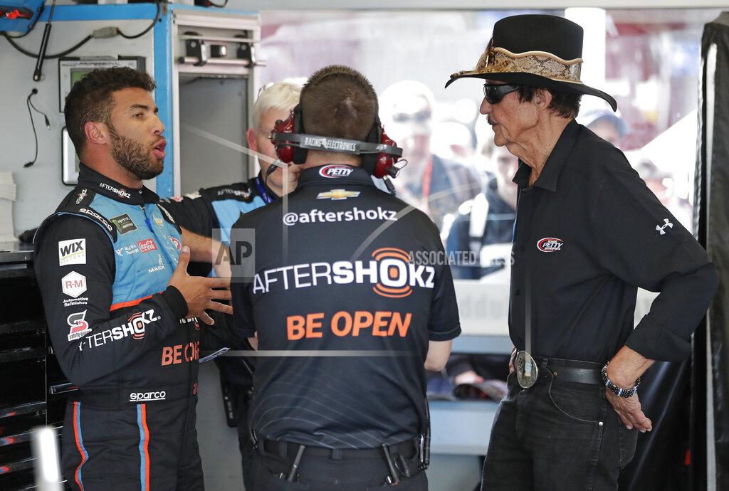 John Raoux Darrell Wallace Jr. , left, talks with car owner Richard Petty, right, and other crew members in his garage during a practice session for the NASCAR Daytona 500 at Daytona International Speedway, Friday, Feb. 15, 2019, in Daytona Beach, Fla. (AP Photo/John Raoux)