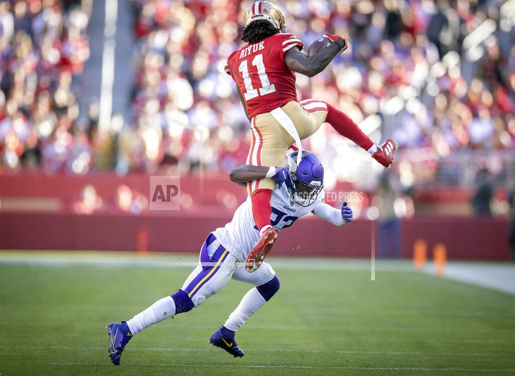 Elizabeth Flores Minnesota Vikings free safety Xavier Woods (23) stops San Francisco 49ers wide receiver Brandon Aiyuk (11) who was trying to hurdle him in the second quarter of an NFL football game Sunday, Nov. 28, 2021, in Santa Clara, Calif. (Elizabeth Flores/Star Tribune via AP)