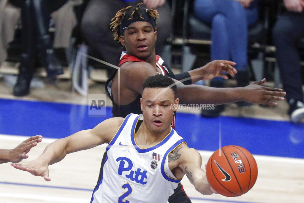 Keith Srakocic Pittsburgh's Trey McGowens (2) passes after getting around Northern Illinois's Eugene German during the second half of an NCAA college basketball game, Monday, Dec. 16, 2019, in Pittsburgh. Pittsburgh won 59-50. (AP Photo/Keith Srakocic)