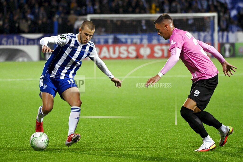 Emmi Korhonen Helsinki's Roope Riski, left, and Felix Luckeneder of LASK battle for the ball during the Europa Conference League Group A soccer match between HJK Helsinki and LASK Lienz in Helsinki, Finland, Thursday Sept. 16, 2021. (Emmi Korhonen/Lehtikuva via AP)