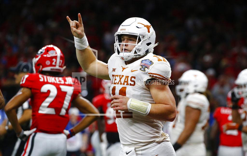 Butch Dill Texas quarterback Sam Ehlinger (11) celebrates his second touchdown carry in the first half of the Sugar Bowl NCAA college football game against Georgia in New Orleans, Tuesday, Jan. 1, 2019. (AP Photo/Butch Dill)
