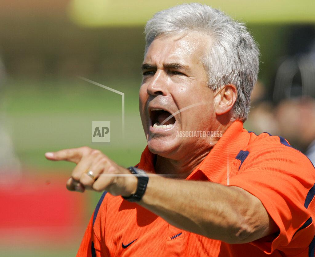 Ed Reinke FILE - Syracuse coach Greg Robinson has words for an official during the first half of his team's NCAA college football game against Louisville in Louisville, Ky., Saturday, Sept. 22, 2007. Greg Robinson, who spent nearly four decades coaching in the NFL and college, has died at 70. His wife Laura confirmed that he died on Wednesday, Jan. 5, 2022, from a form of Alzheimer's Disease. (AP Photo/Ed Reinke, File)
