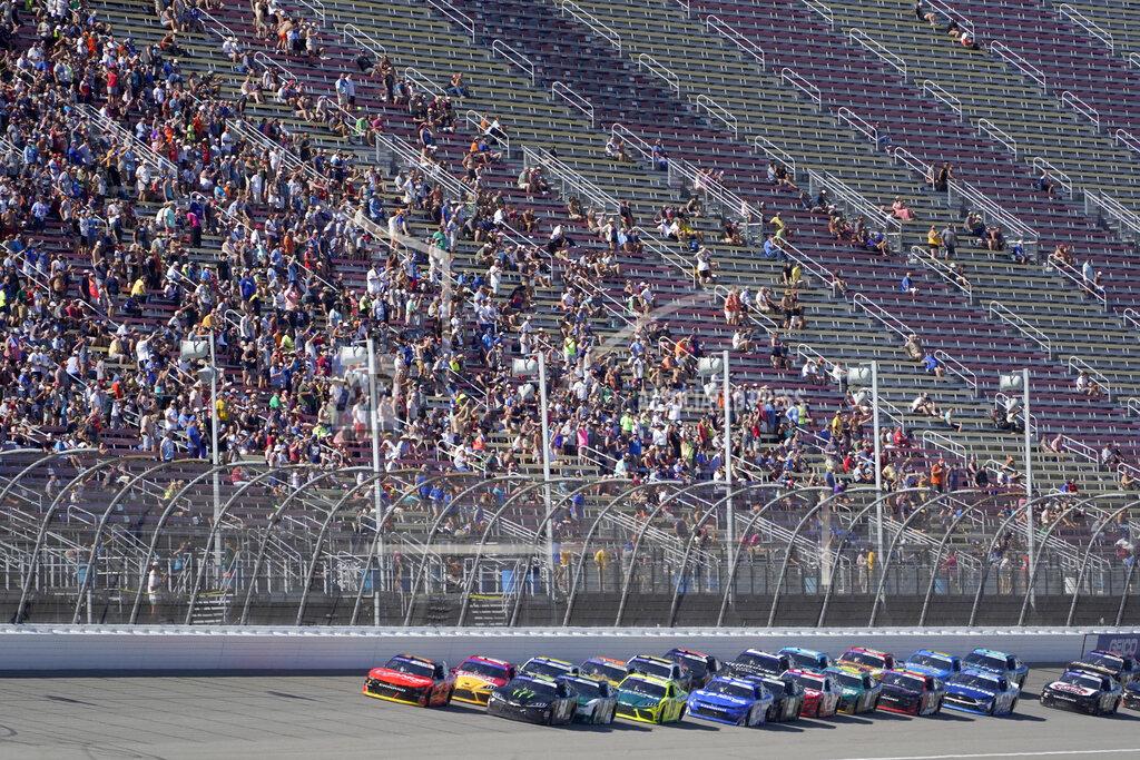 Paul Sancya Ty Gibbs (54) leads the field into a restart during the New Holland 250 NASCAR Xfinity Series auto race at the Michigan International Speedway in Brooklyn, Mich., Saturday, Aug. 6, 2022. (AP Photo/Paul Sancya)