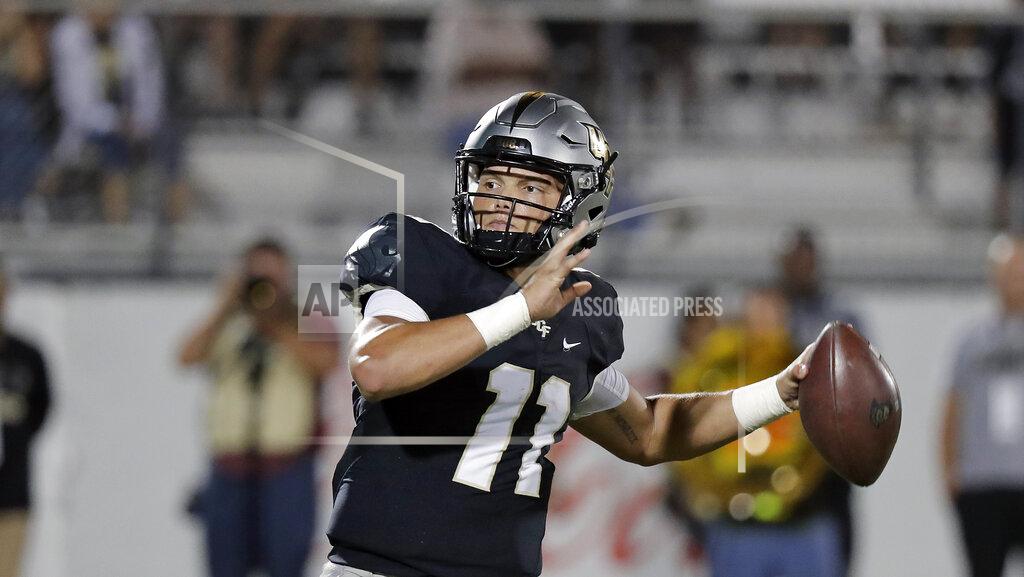John Raoux Central Florida quarterback Dillon Gabriel (11) looks for a receiver during the second half of an NCAA college football game against East Carolina, Saturday, Oct. 19, 2019, in Orlando, Fla. Gabriel and the 13th-ranked Knights open American Athletic Conference play on the road Saturday at East Carolina. (AP Photo/John Raoux)