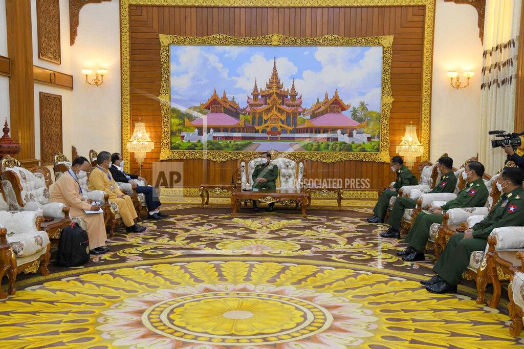 Uncredited In this photo provided by the Myanmar Military True News Information Team, Senior Gen. Min Aung Hlaing, center, head of the military council, talks with Yawd Serk, third from left, chairman of the Restoration Council of Shan State/Shan State Army, during their meeting Friday, May 20, 2022, in Naypyitaw, Myanmar. (Military True News Information Team via AP)