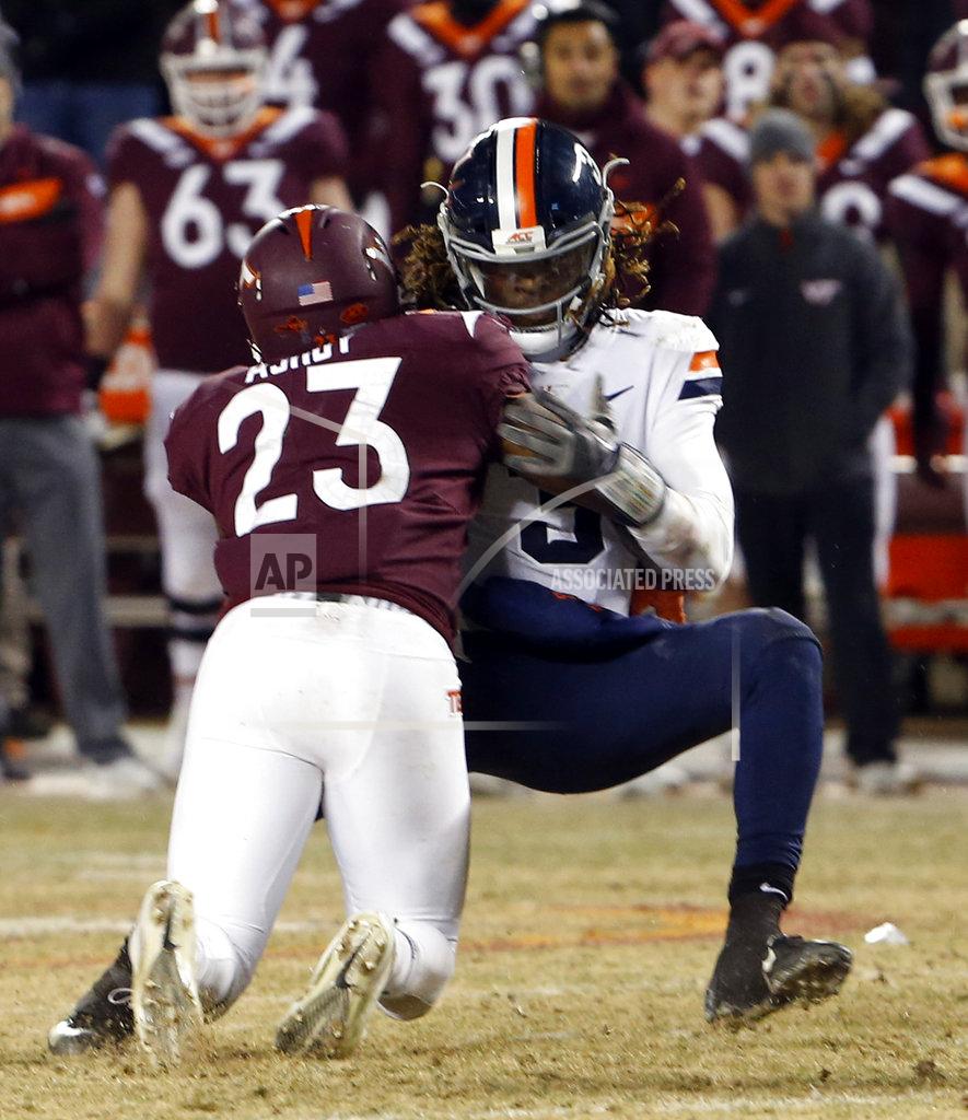 Steve Helber Virginia quarterback Bryce Perkins (3) is sacked by Virginia Tech linebacker Rayshard Ashby (23) and loses the football during overtime of an NCAA college football game in Blacksburg, Va., Friday, Nov. 23, 2018. Virginia Tech won 34-31. (AP Photo/Steve Helber)