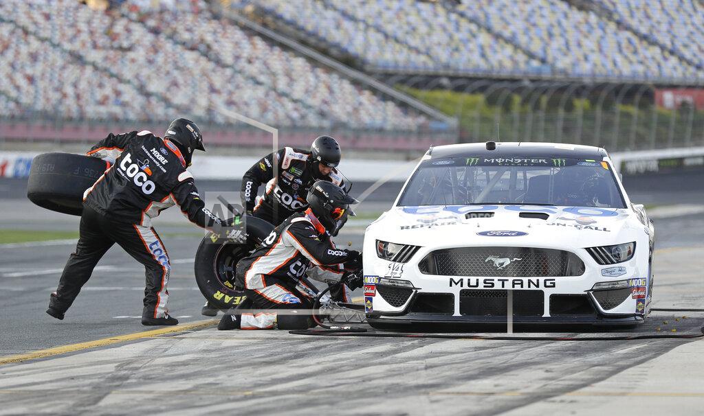 Chuck Burton Crew members perform a pit stop on Clint Bowyer's car during qualifying for Saturday's NASCAR All-Star auto race at Charlotte Motor Speedway in Concord, N.C., Friday, May 17, 2019. Bowyer won the pole position for the race. (AP Photo/Chuck Burton)