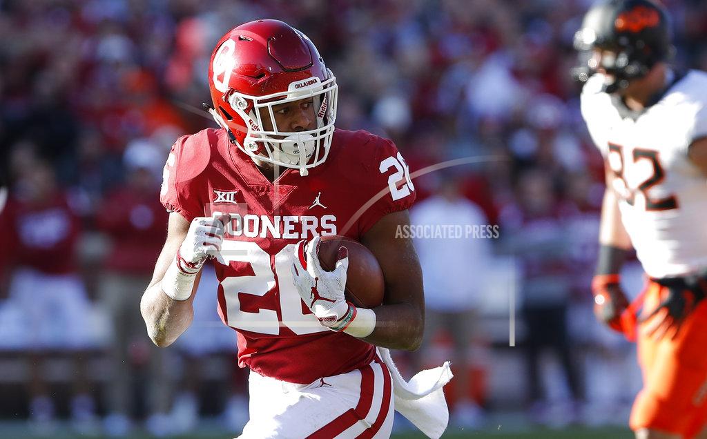 Alonzo Adams Oklahoma running back Kennedy Brooks (26) runs in for a touchdown against Oklahoma State in the second quarter of an NCAA college football game in Norman, Okla., Saturday, Nov. 10, 2018. (AP Photo/Alonzo Adams)