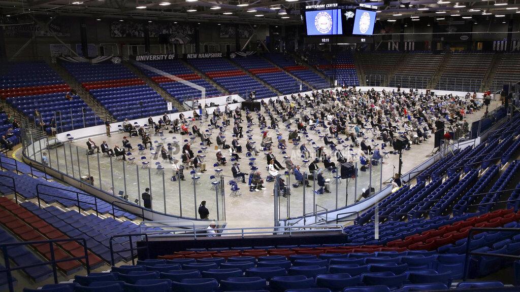 Charles Krupa FILE - In this June 30, 2020, file photo, New Hampshire House of Representatives members gather for a legislative session on the drained hockey rink at the University of New Hampshire in Durham, N.H. The House met for their scheduled final session of the year with safety restrictions due to the COVID-19 virus outbreak. The coronavirus pandemic was New Hampshire's top story of 2020. (AP Photo/Charles Krupa, File)