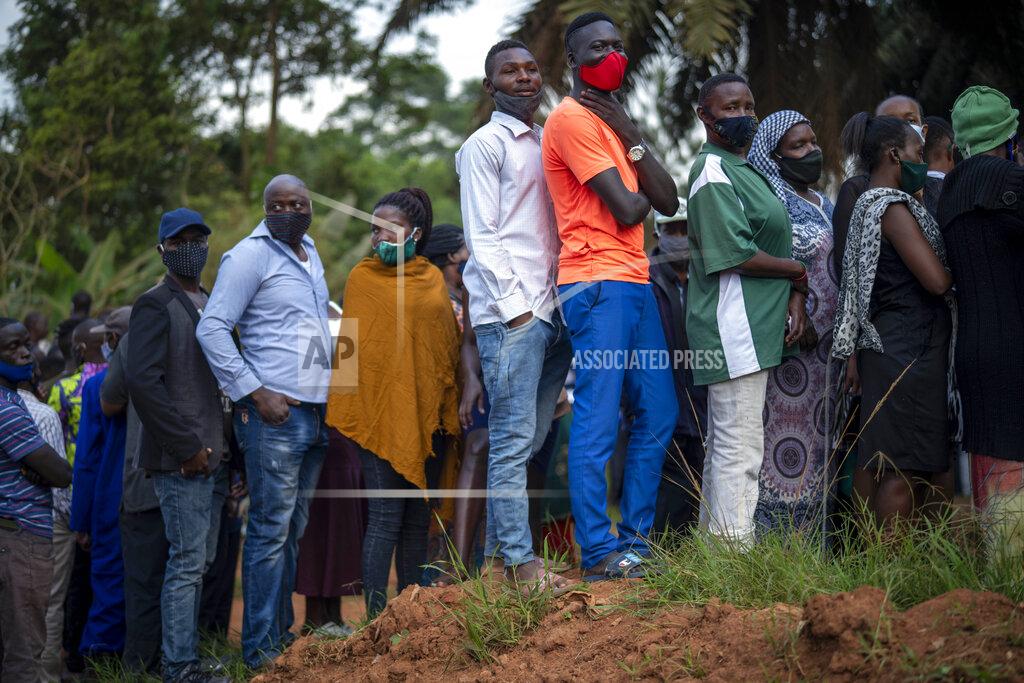 Jerome Delay Ugandans wait to vote in Kampala, Uganda, Thursday, Jan. 14, 2021. Ugandans are voting in a presidential election tainted by widespread violence that some fear could escalate as security forces try to stop supporters of leading opposition challenger BobiWine from monitoring polling stations.(AP Photo/Jerome Delay)